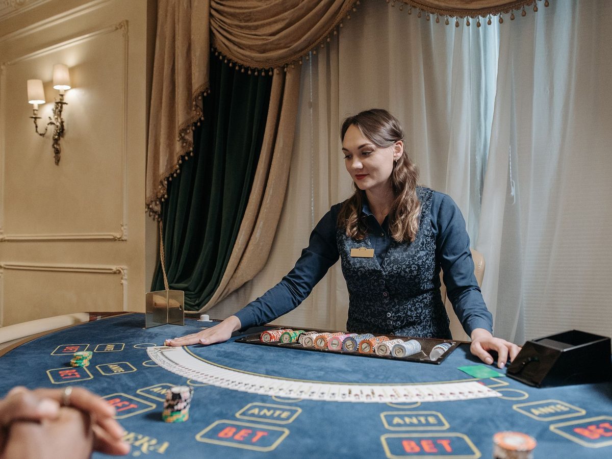 A dealer at one of the tables